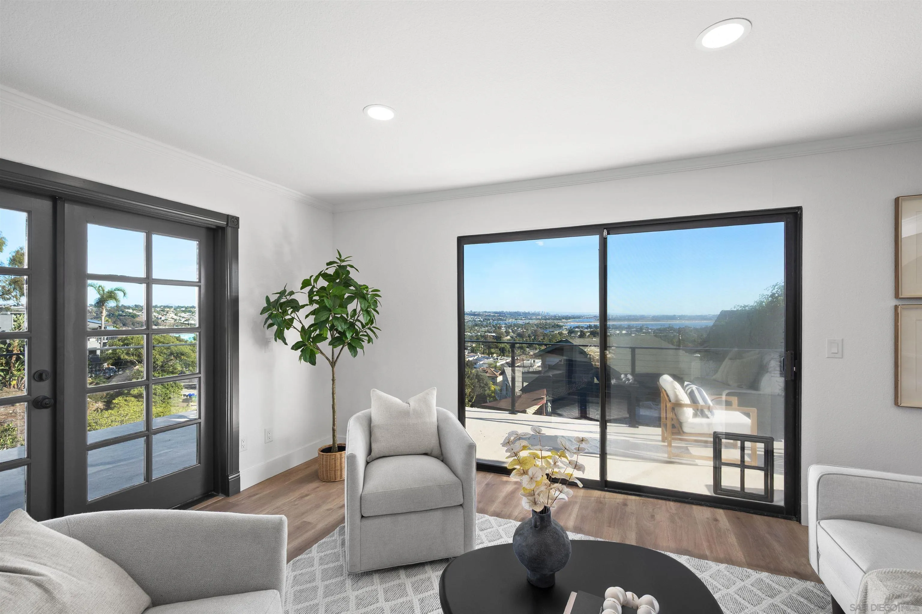 2431 Wilbur Avenue San Diego, CA 92109 - Photo 24 of 56 a living room with furniture and a floor to ceiling window