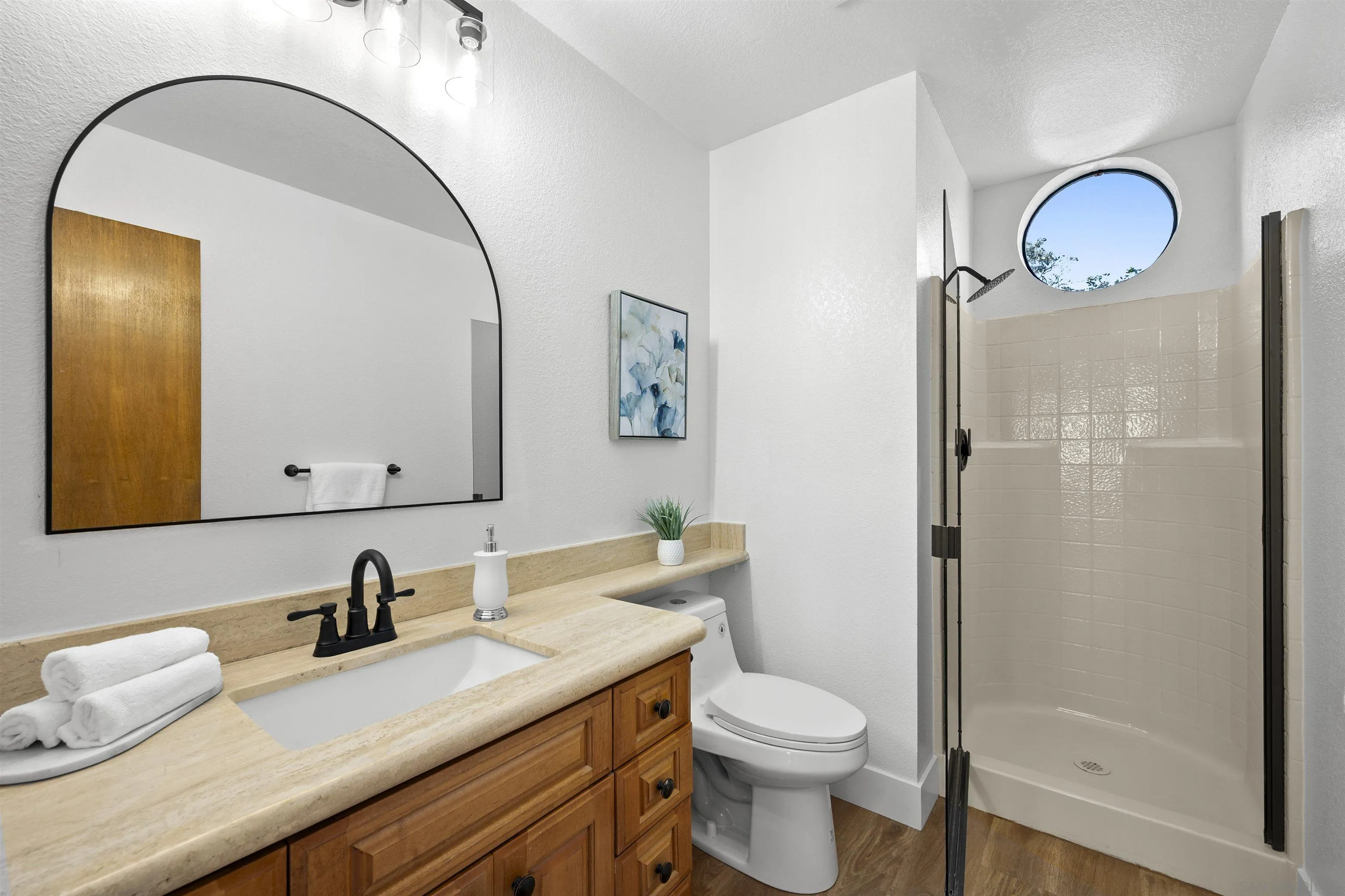2431 Wilbur Avenue San Diego, CA 92109 - Photo 26 of 56 a bathroom with a granite countertop sink toilet and shower