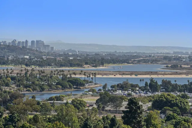 a kitchen with a sink a table and chairs