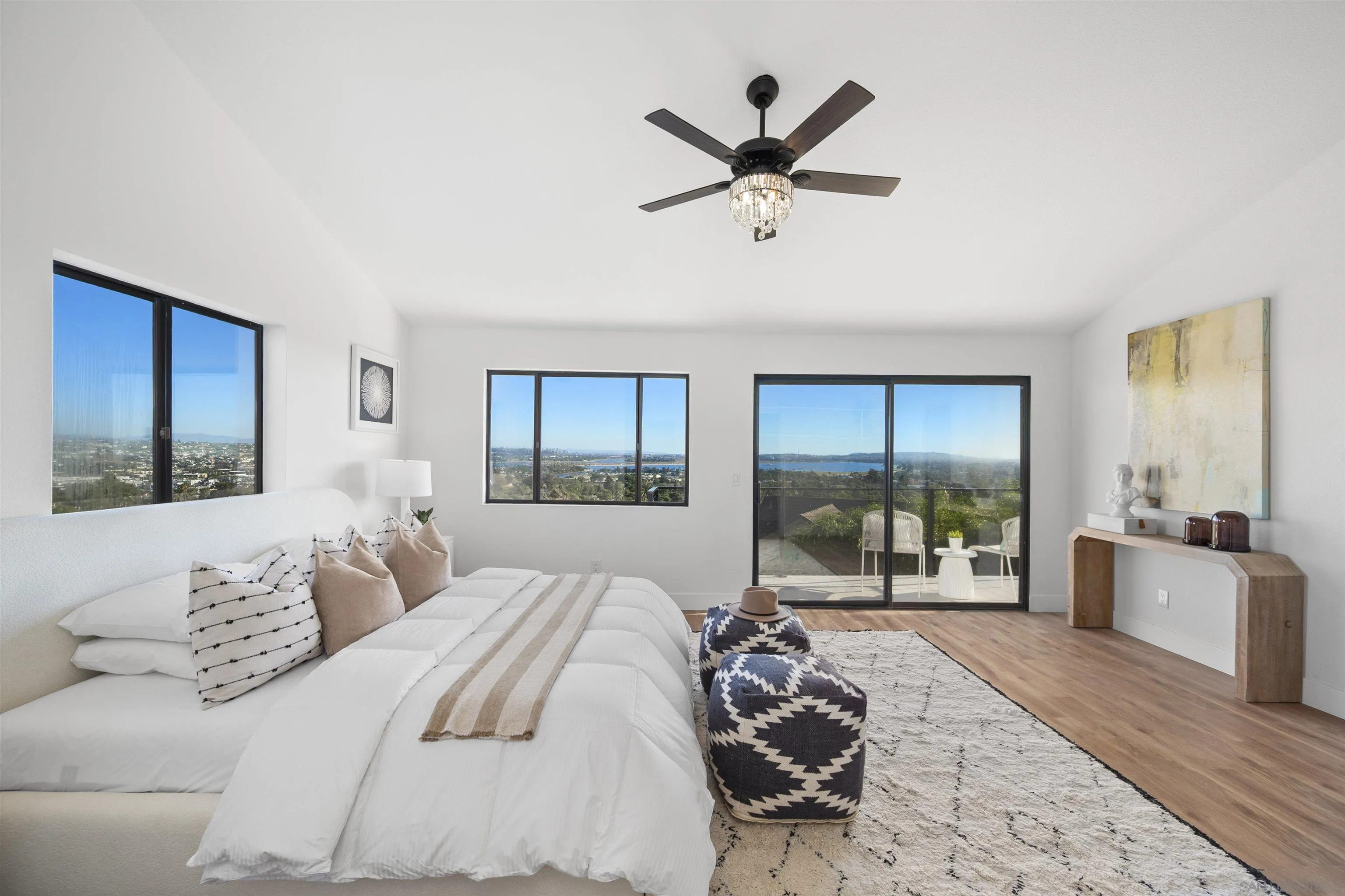 2431 Wilbur Avenue San Diego, CA 92109 - Photo 34 of 56 a bedroom with a large bed and a large window