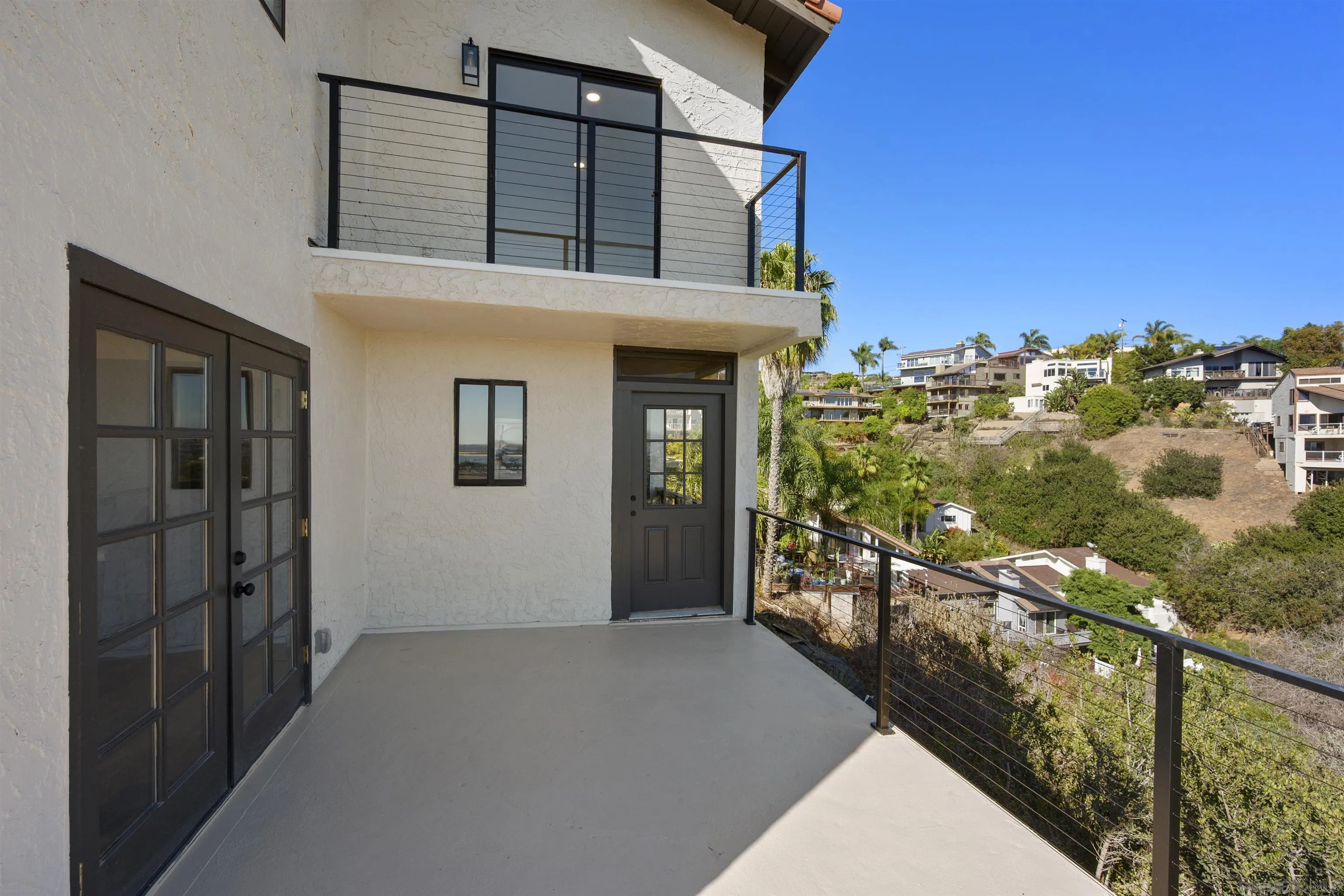 2431 Wilbur Avenue San Diego, CA 92109 - Photo 44 of 56 a view of a house and wooden balcony