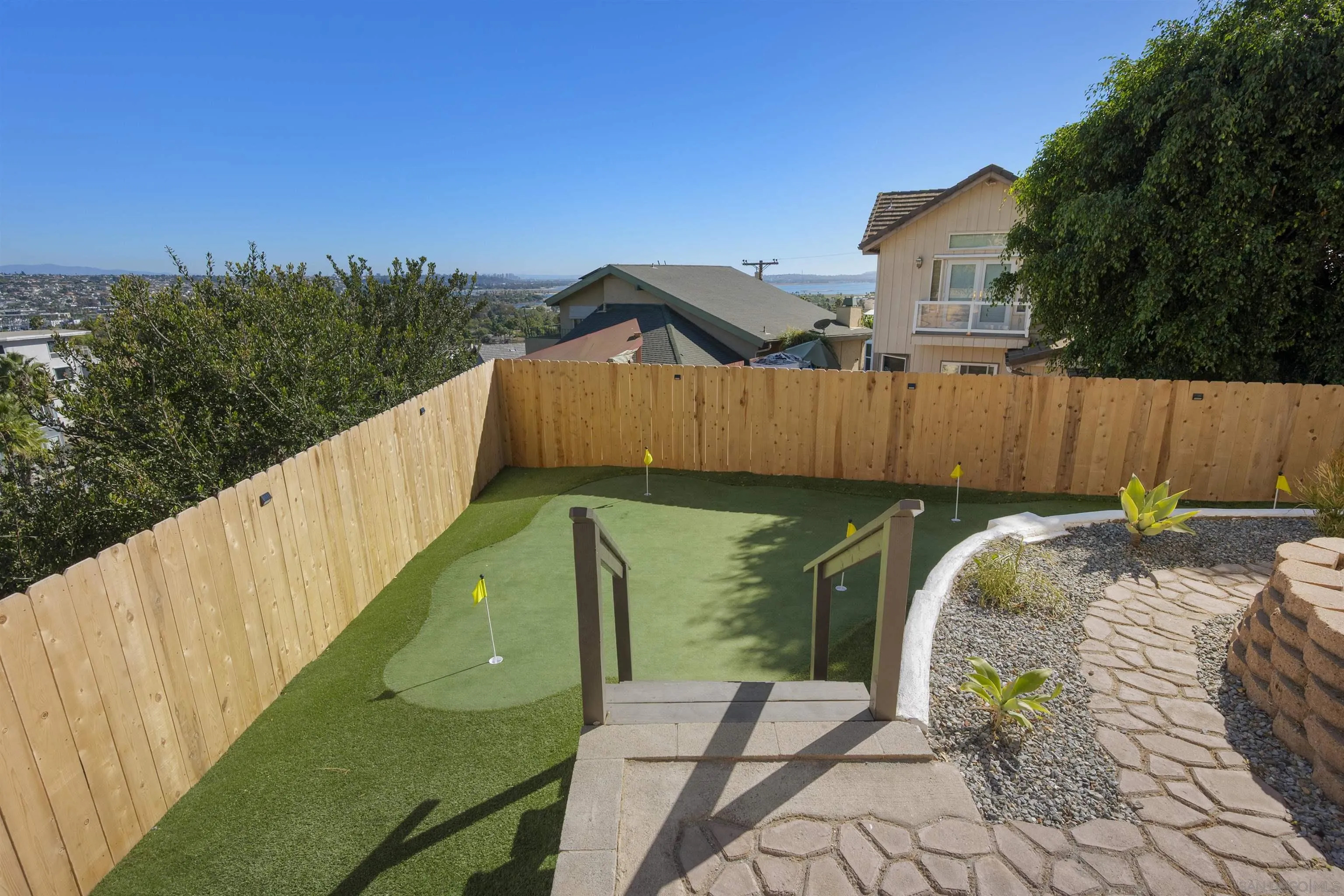 2431 Wilbur Avenue San Diego, CA 92109 - Photo 47 of 56 a view of a garden with wooden fence