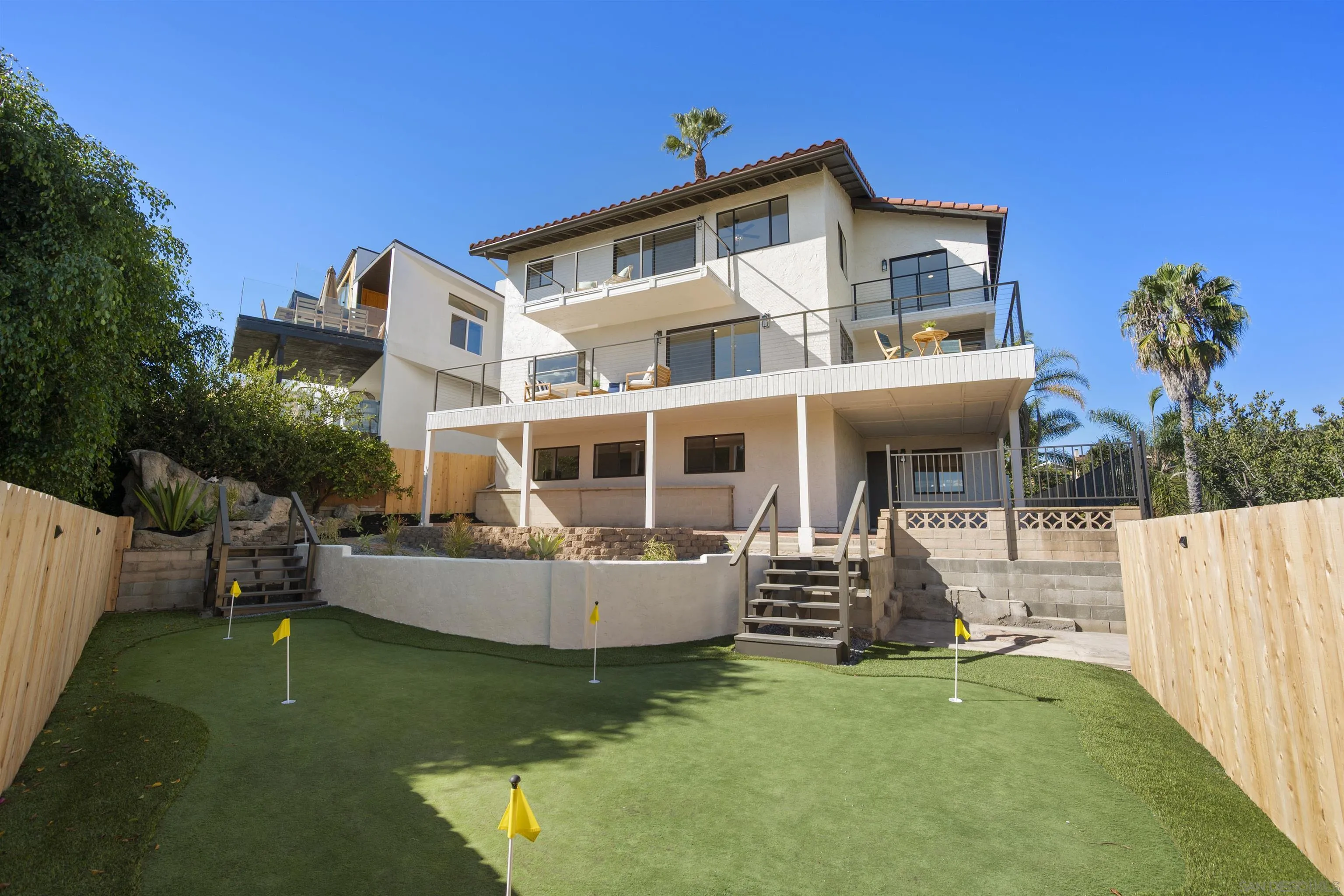2431 Wilbur Avenue San Diego, CA 92109 - Photo 48 of 56 a view of a house with backyard porch and sitting area
