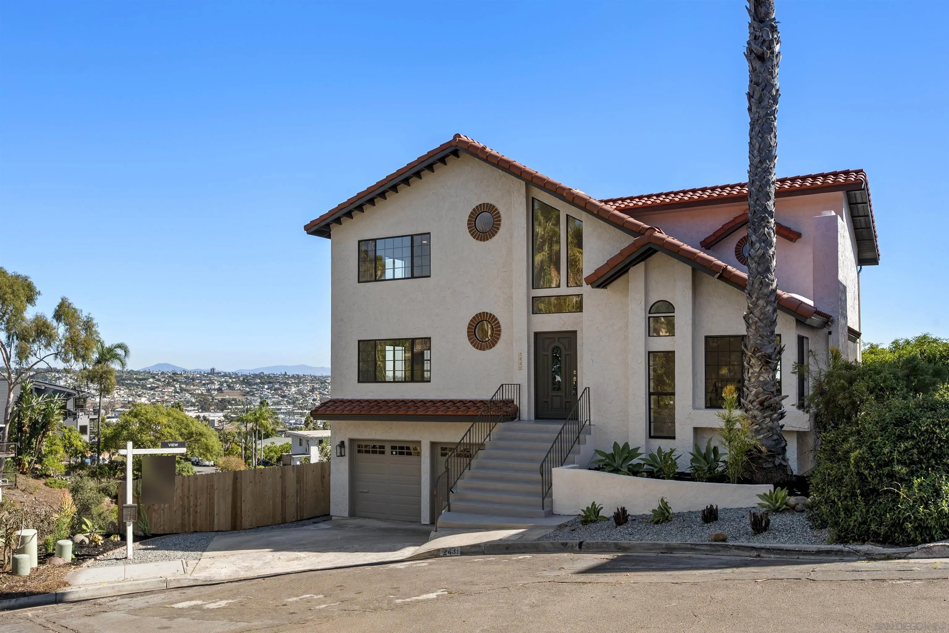 2431 Wilbur Avenue San Diego, CA 92109 - Photo 5 of 56 a front view of a house with a yard