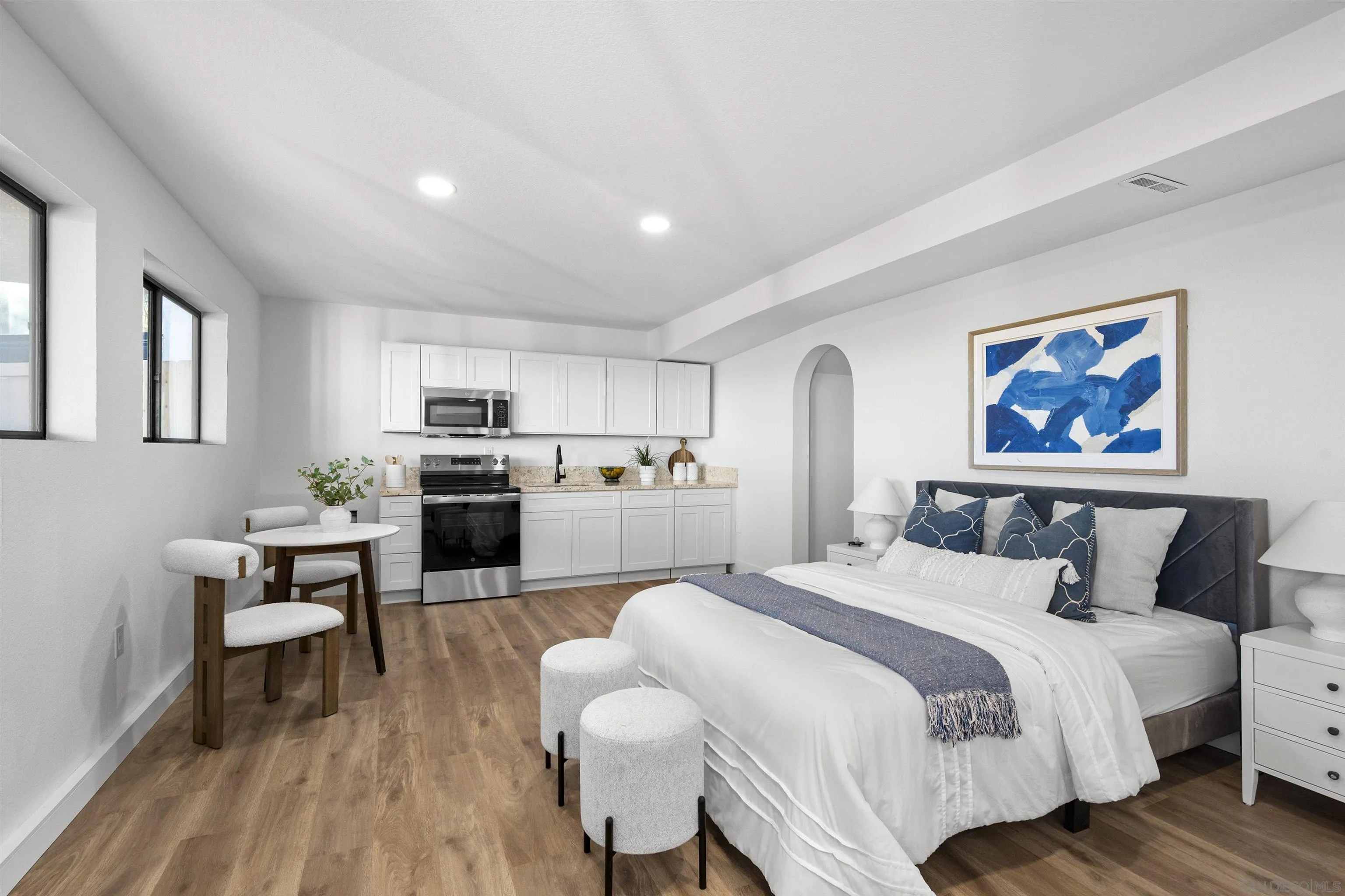 2431 Wilbur Avenue San Diego, CA 92109 - Photo 51 of 56 a spacious bedroom with a bed and wooden floor