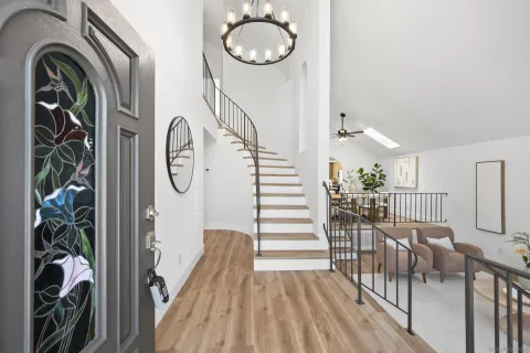 a view of a livingroom with furniture and hardwood floor