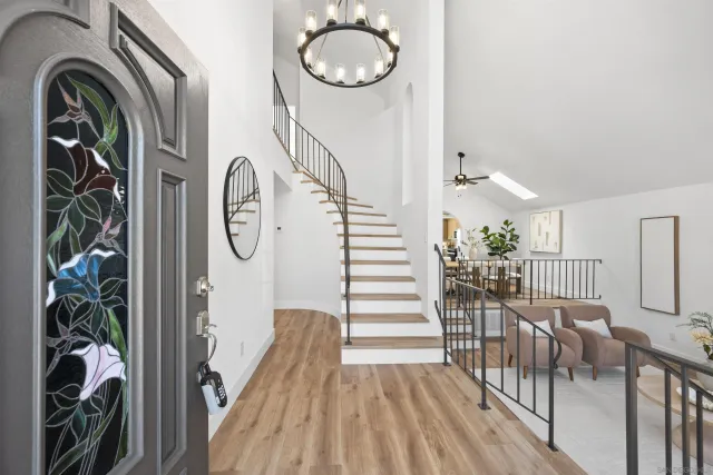 a view of a livingroom with furniture and hardwood floor