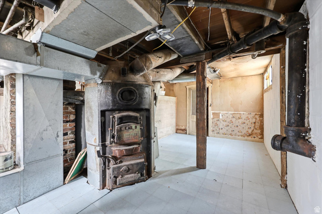 262 West 400 South Springville, UT 84663 - Photo 17 of 17 Basement utility area featuring exposed brick, an antique furnace, and visible ductwork