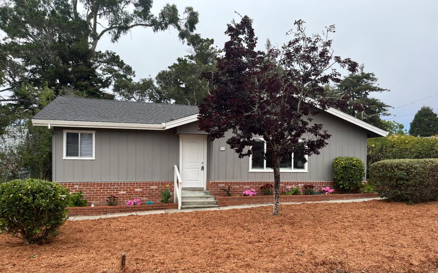 a house with trees in front of it
