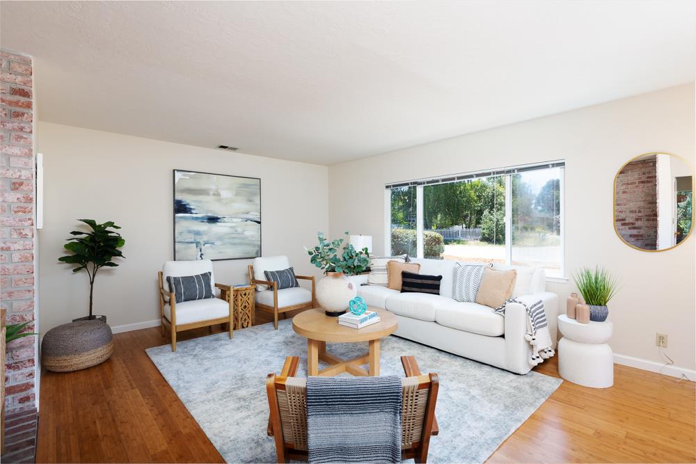 771 Seacliff Drive Aptos, CA 95003 - Photo 3 of 26 a living room with furniture potted plant and a large window