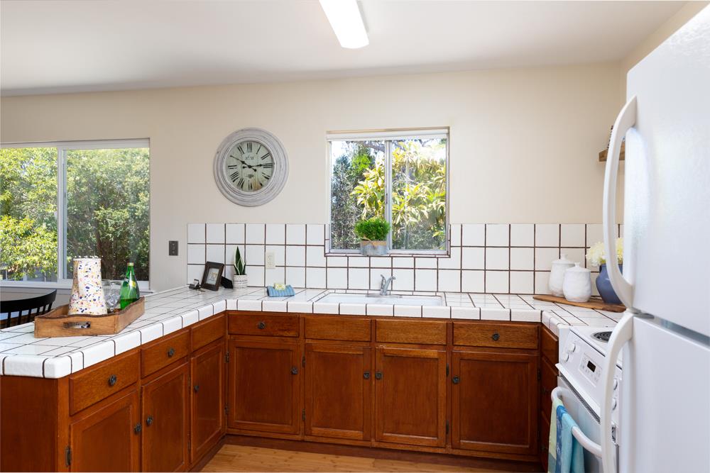 771 Seacliff Drive Aptos, CA 95003 - Photo 8 of 26 a kitchen with a sink and a stove top oven