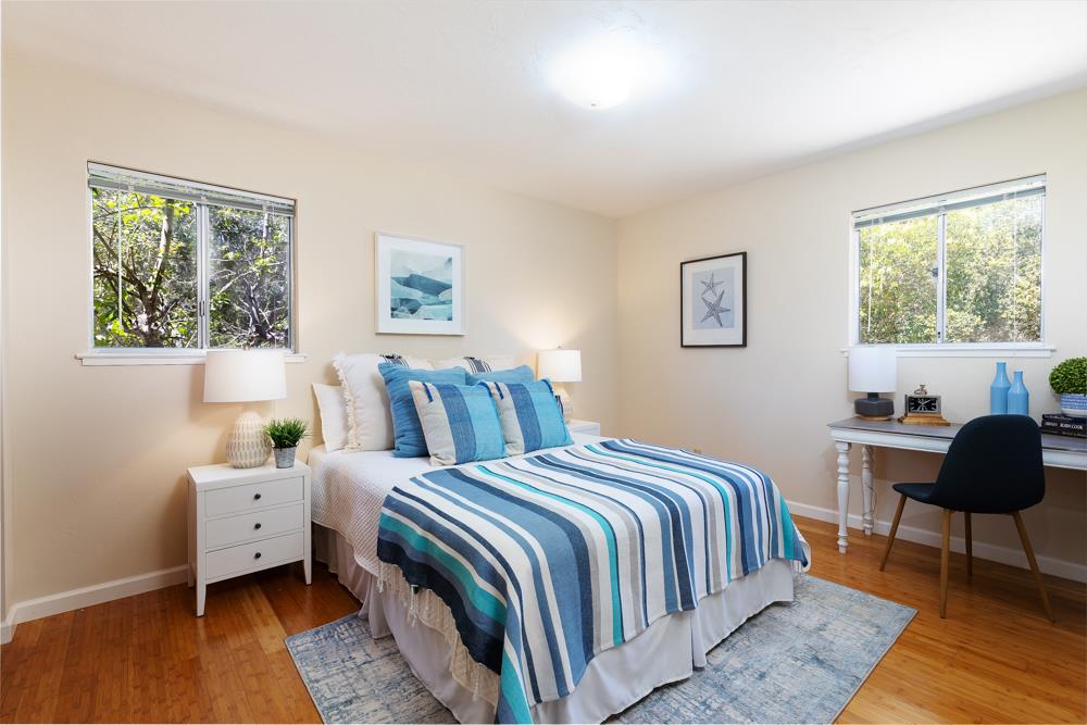 771 Seacliff Drive Aptos, CA 95003 - Photo 10 of 26 a bedroom with a bed a couch and a window