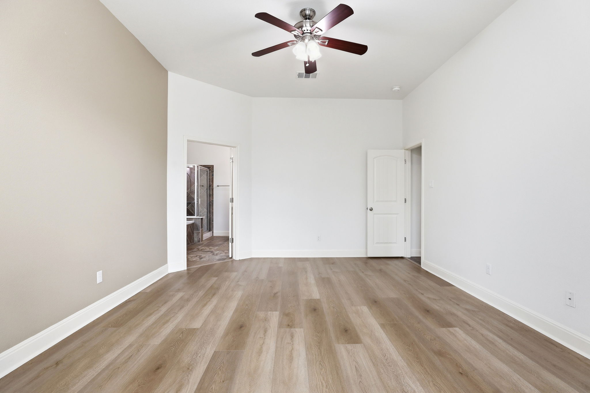 152 Stone View Trail Austin, TX 78737 - Photo 19 of 33 Spare room with a ceiling fan and light wood finished floors