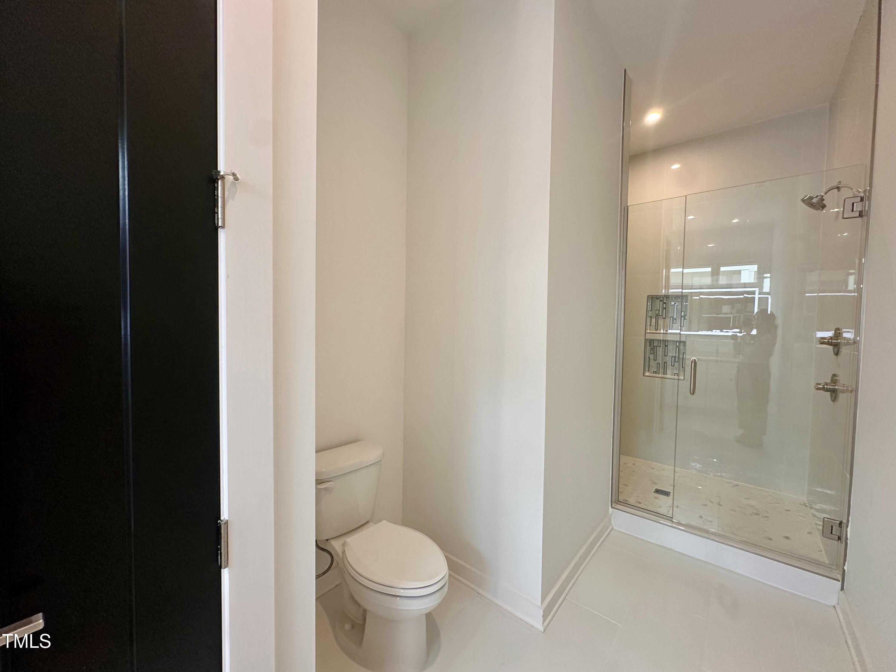 1521 Havenmont Court Raleigh, NC 27608 - Photo 13 of 36 a bathroom with a shower and a toilet