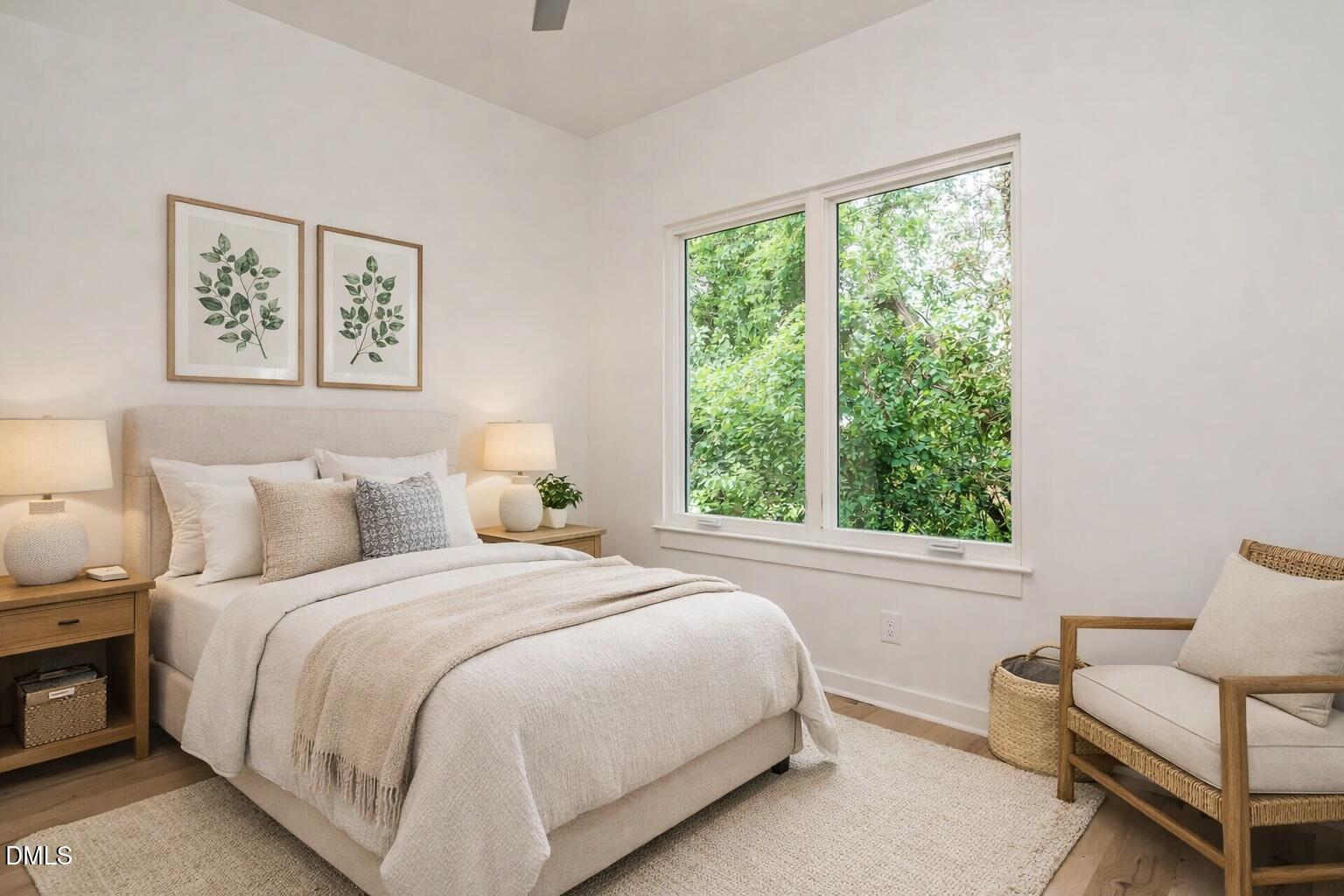 1521 Havenmont Court Raleigh, NC 27608 - Photo 16 of 36 a bedroom with a bed and chair next to a window