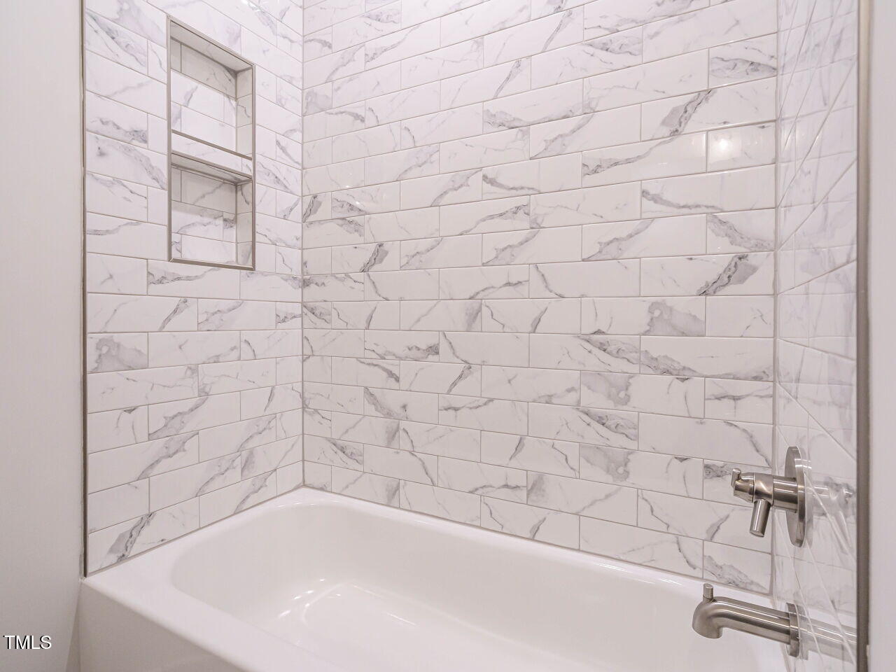 1521 Havenmont Court Raleigh, NC 27608 - Photo 18 of 36 a bathroom with a bathtub