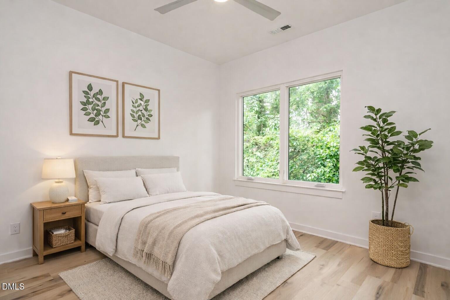 1521 Havenmont Court Raleigh, NC 27608 - Photo 19 of 36 a bedroom with a bed and a window