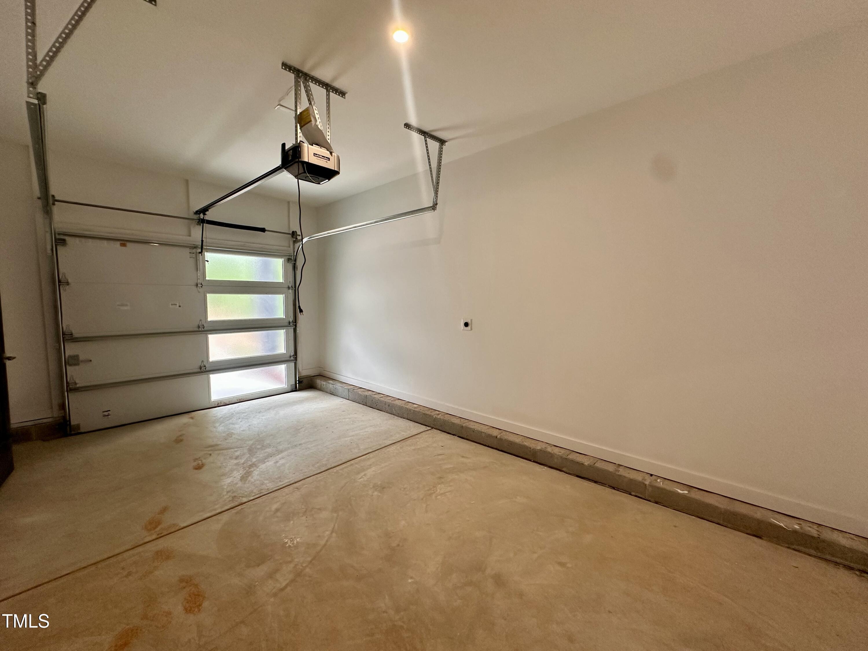 1521 Havenmont Court Raleigh, NC 27608 - Photo 30 of 36 a view of a room with racks on the wall