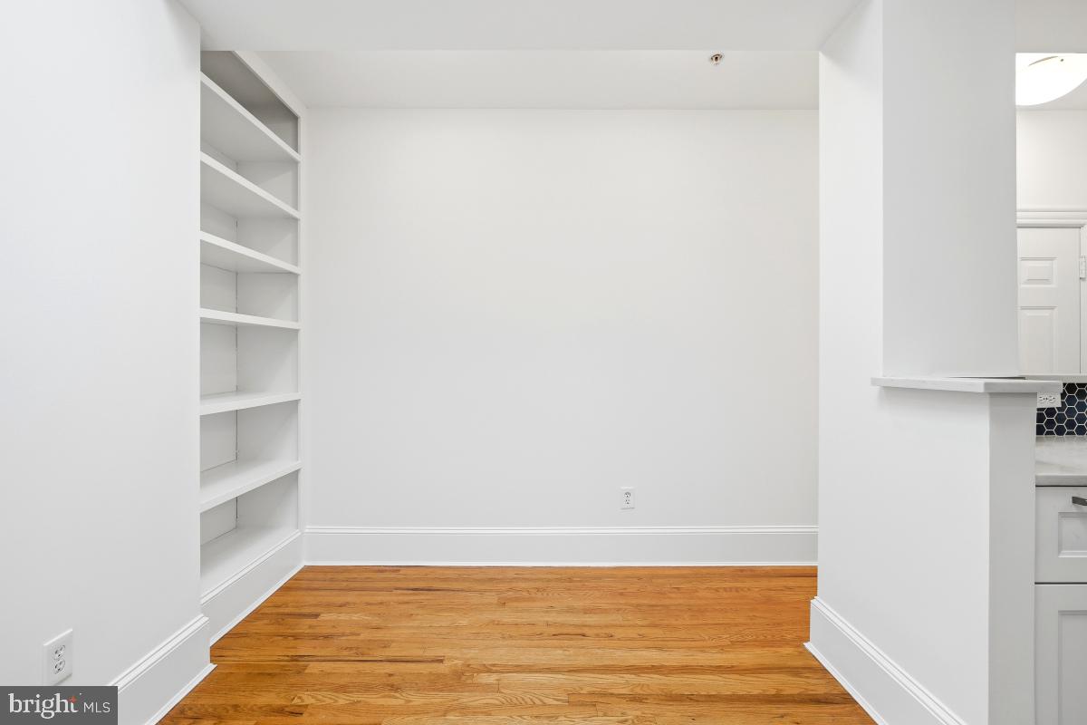 1807 California Street Northwest, Unit 305 Washington, DC 20009 - Photo 17 of 30 a view of a room with empty racks