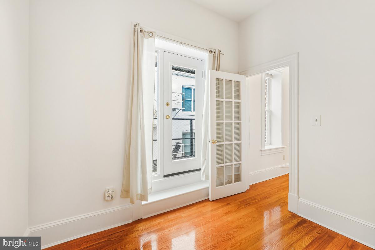 1807 California Street Northwest, Unit 305 Washington, DC 20009 - Photo 20 of 30 a view of empty room with wooden floor and cabinet