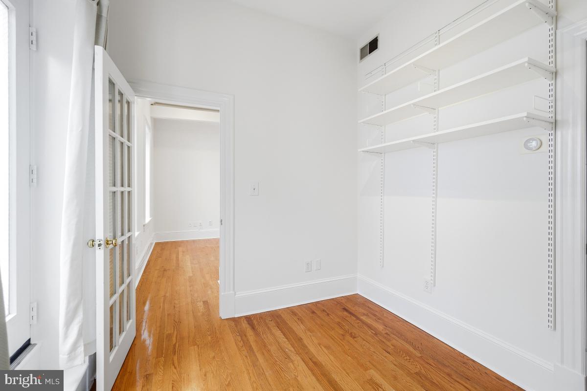 1807 California Street Northwest, Unit 305 Washington, DC 20009 - Photo 21 of 30 a view of a room with wooden floor and a window