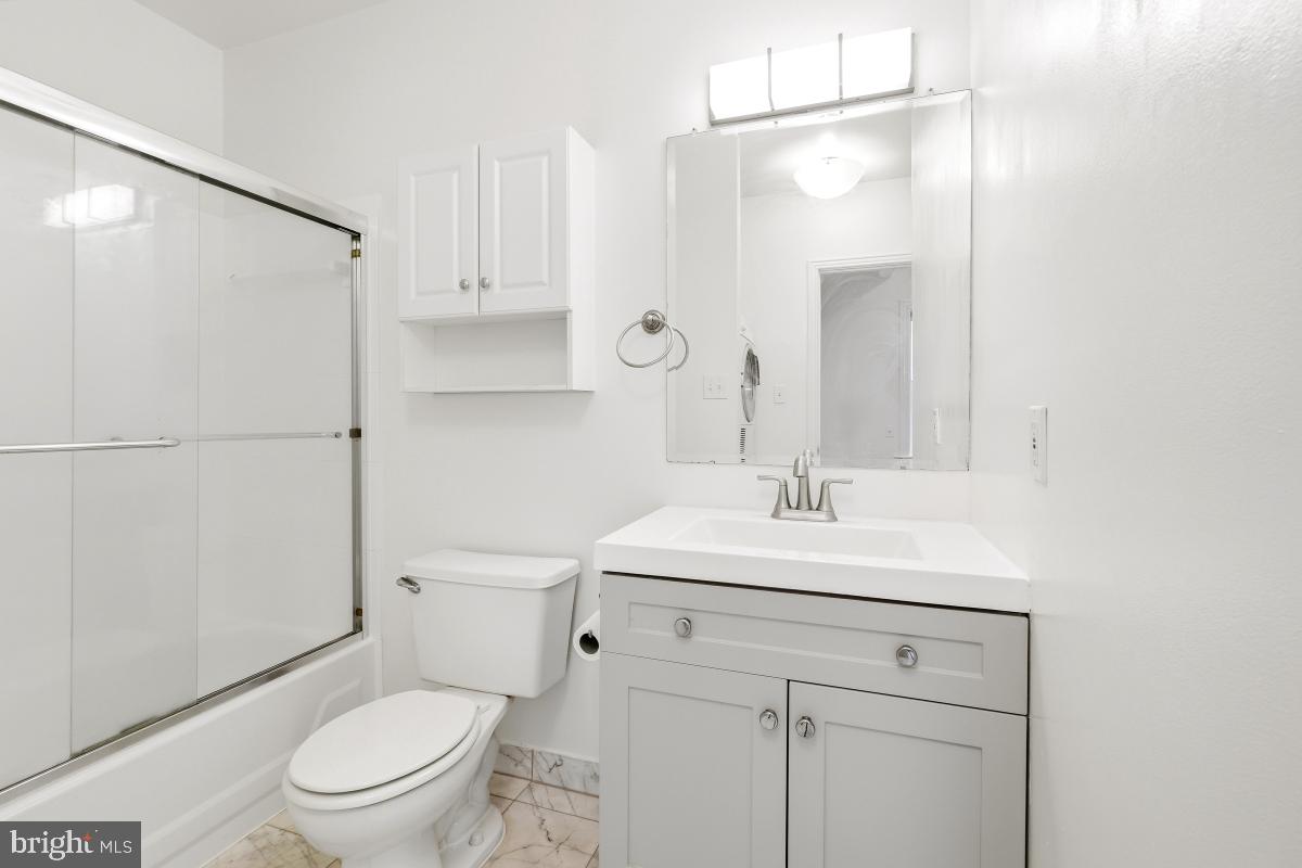 1807 California Street Northwest, Unit 305 Washington, DC 20009 - Photo 24 of 30 a bathroom with a sink toilet vanity and shower