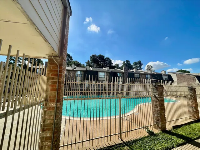 a view of a wrought iron fences in front of house