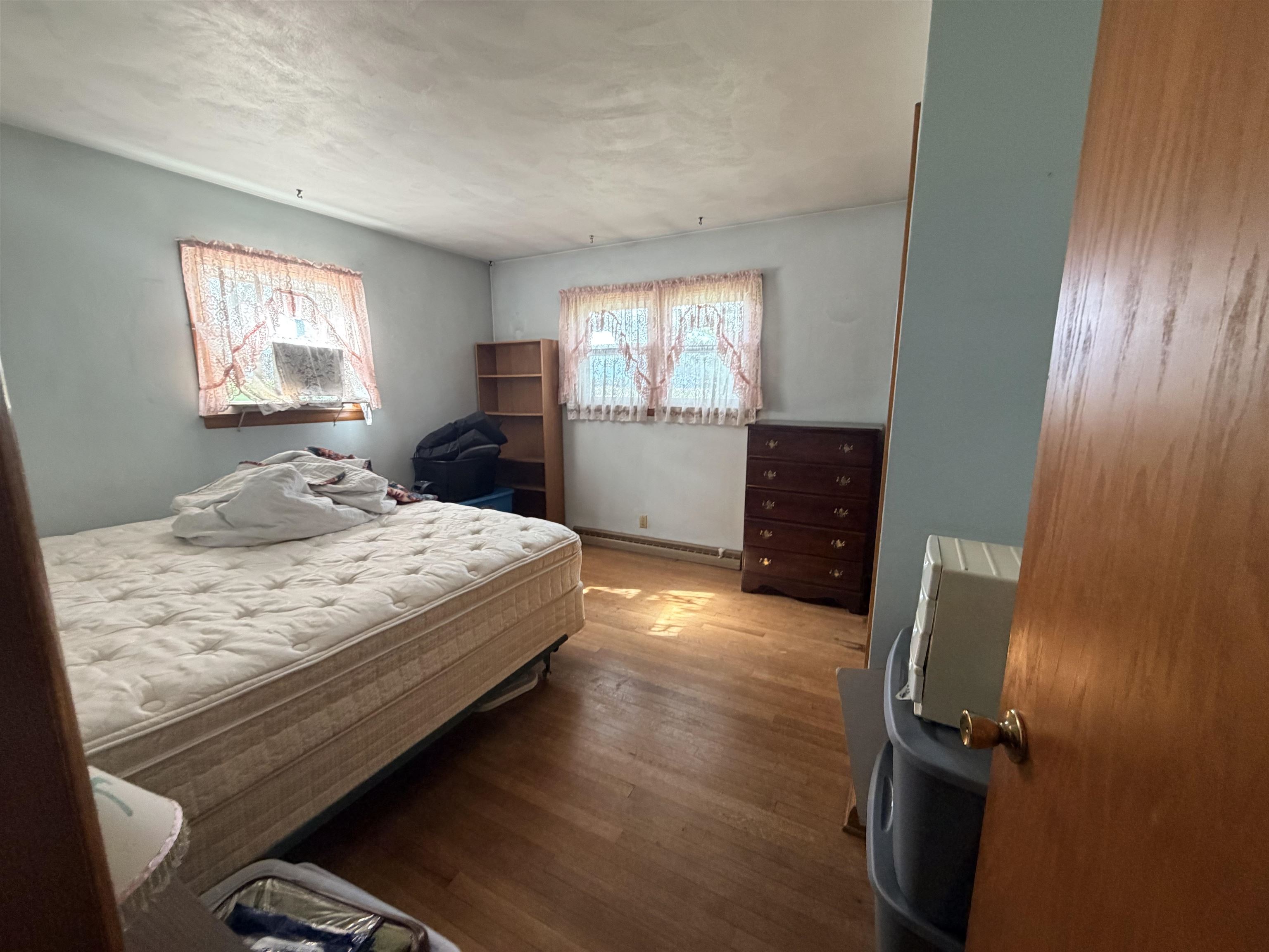 2280 South Rock City Road Ridott, IL 61067 - Photo 24 of 59 a bedroom with a bed and wooden floor