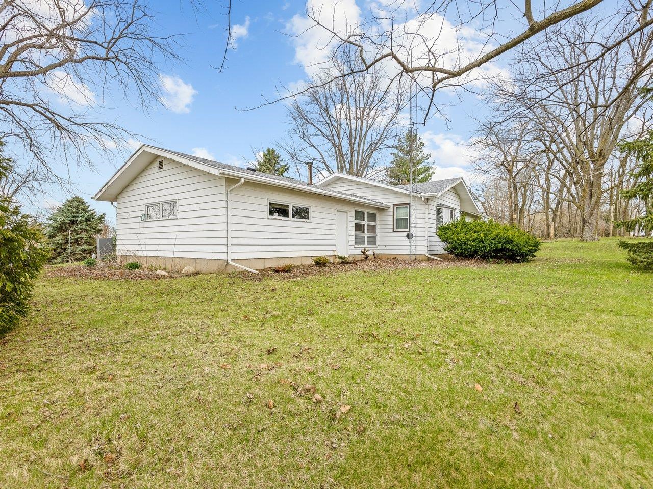 2280 South Rock City Road Ridott, IL 61067 - Photo 4 of 59 a house view with a garden space