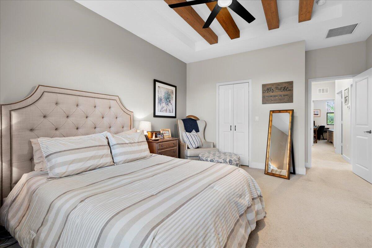 6013 Pine Tree Way Riviera Beach, FL 33410 - Photo 15 of 33 a bedroom with a bed and a walk in closet
