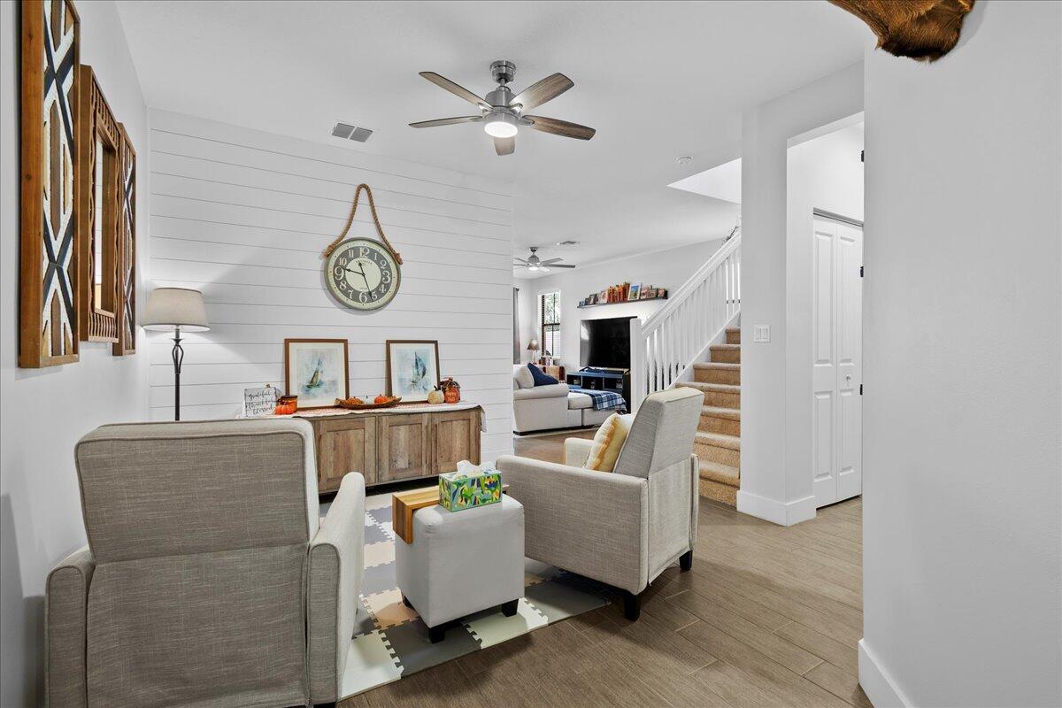 6013 Pine Tree Way Riviera Beach, FL 33410 - Photo 2 of 33 a living room with furniture and a clock