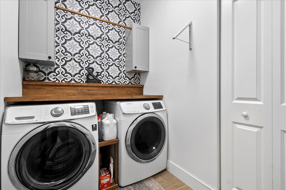 6013 Pine Tree Way Riviera Beach, FL 33410 - Photo 21 of 33 a utility room with dryer and washer