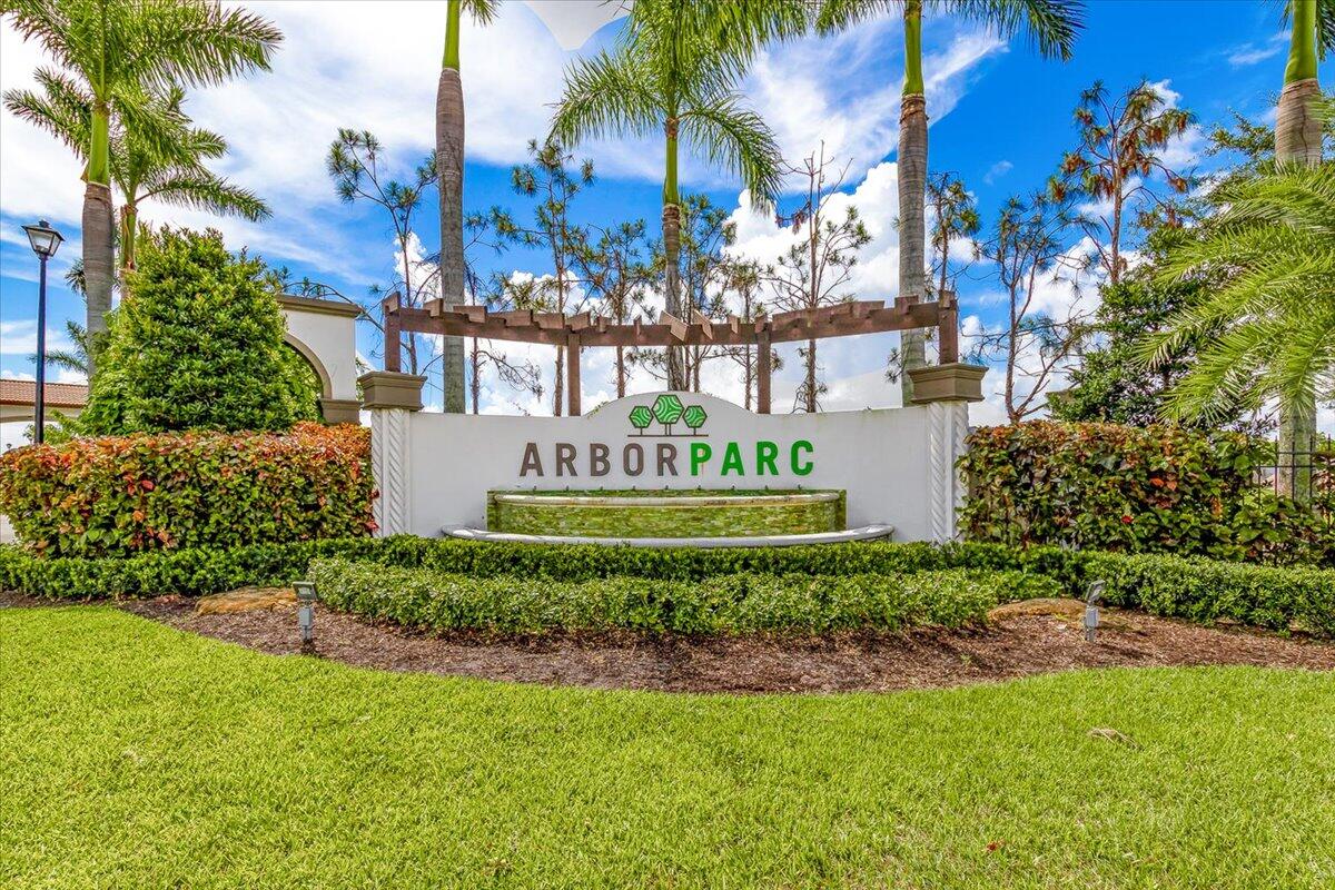 6013 Pine Tree Way Riviera Beach, FL 33410 - Photo 22 of 33 a sign on the side of a building