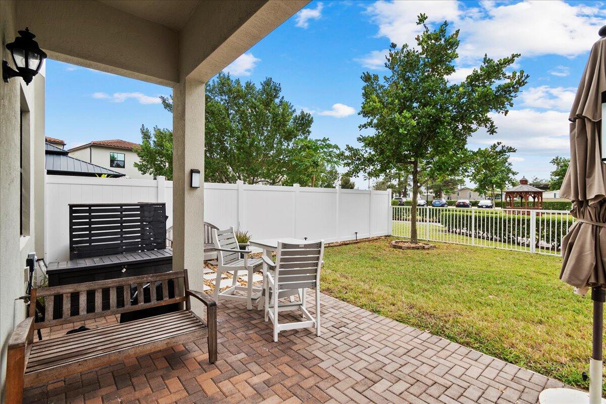 6013 Pine Tree Way Riviera Beach, FL 33410 - Photo 24 of 33 a view of outdoor space with seating