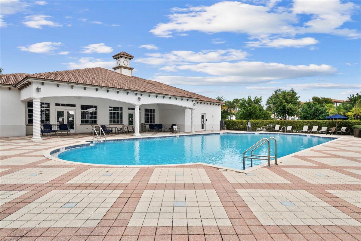 6013 Pine Tree Way Riviera Beach, FL 33410 - Photo 25 of 33 a view of a house with swimming pool