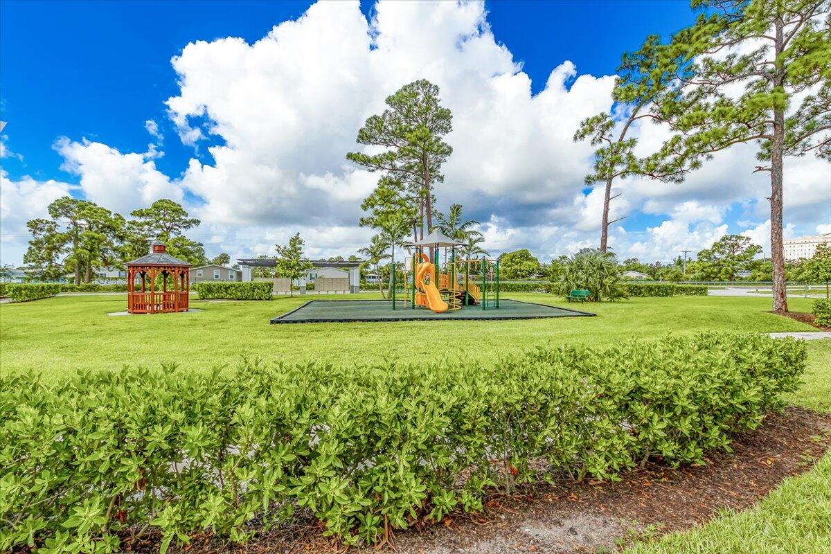 6013 Pine Tree Way Riviera Beach, FL 33410 - Photo 29 of 33 a view of a park with large trees