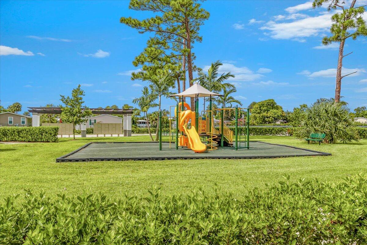 6013 Pine Tree Way Riviera Beach, FL 33410 - Photo 30 of 33 a view of a volley ball court