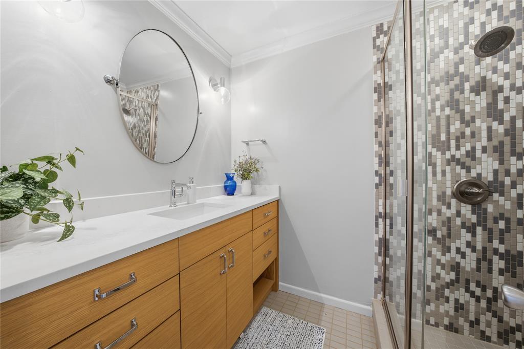 111 Ridgeoak Way Tool, TX 75143 - Photo 12 of 21 a bathroom with a granite countertop sink a mirror and shower