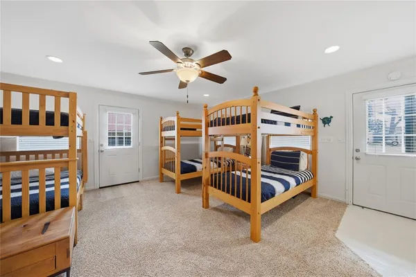 a bedroom with furniture and white walls