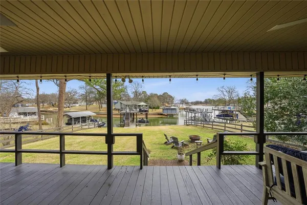 a view of a balcony with wooden floor and outdoor space