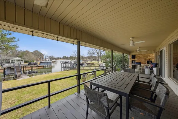 an outdoor view from a balcony with seating space