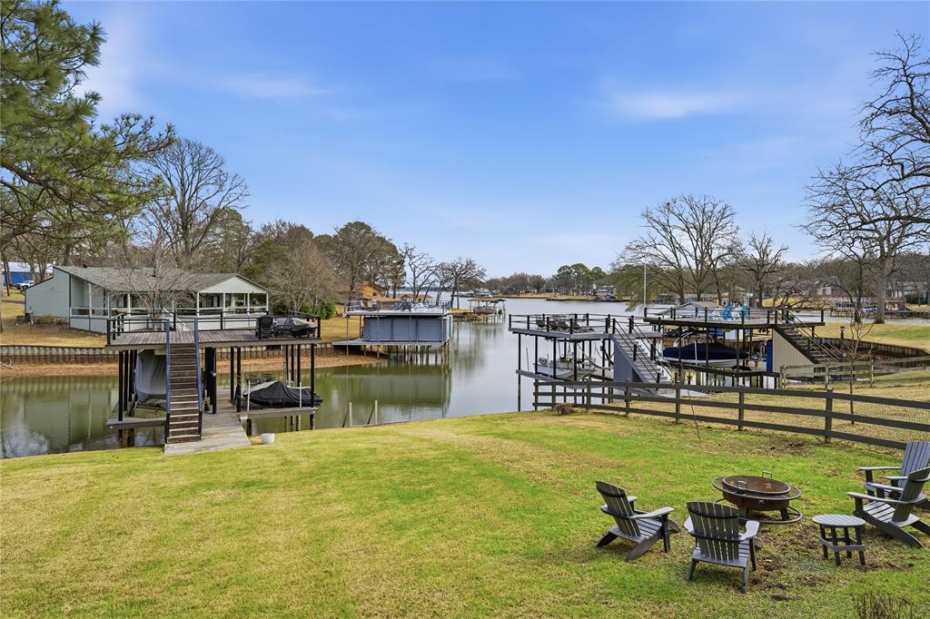 111 Ridgeoak Way Tool, TX 75143 - Photo 18 of 21 a view of swimming pool with outdoor seating and a garden