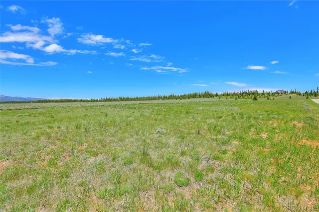 a view of a yard with an outdoor space and deck