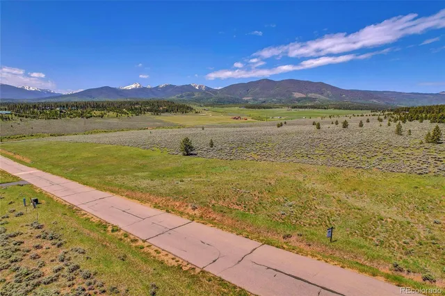 a view of an ocean and a mountain