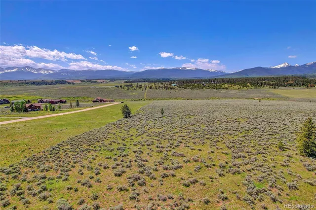 a view of an ocean and a mountain