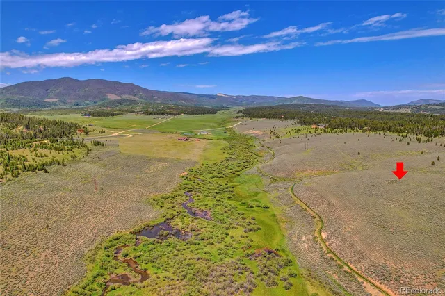 a view of an ocean and a mountain