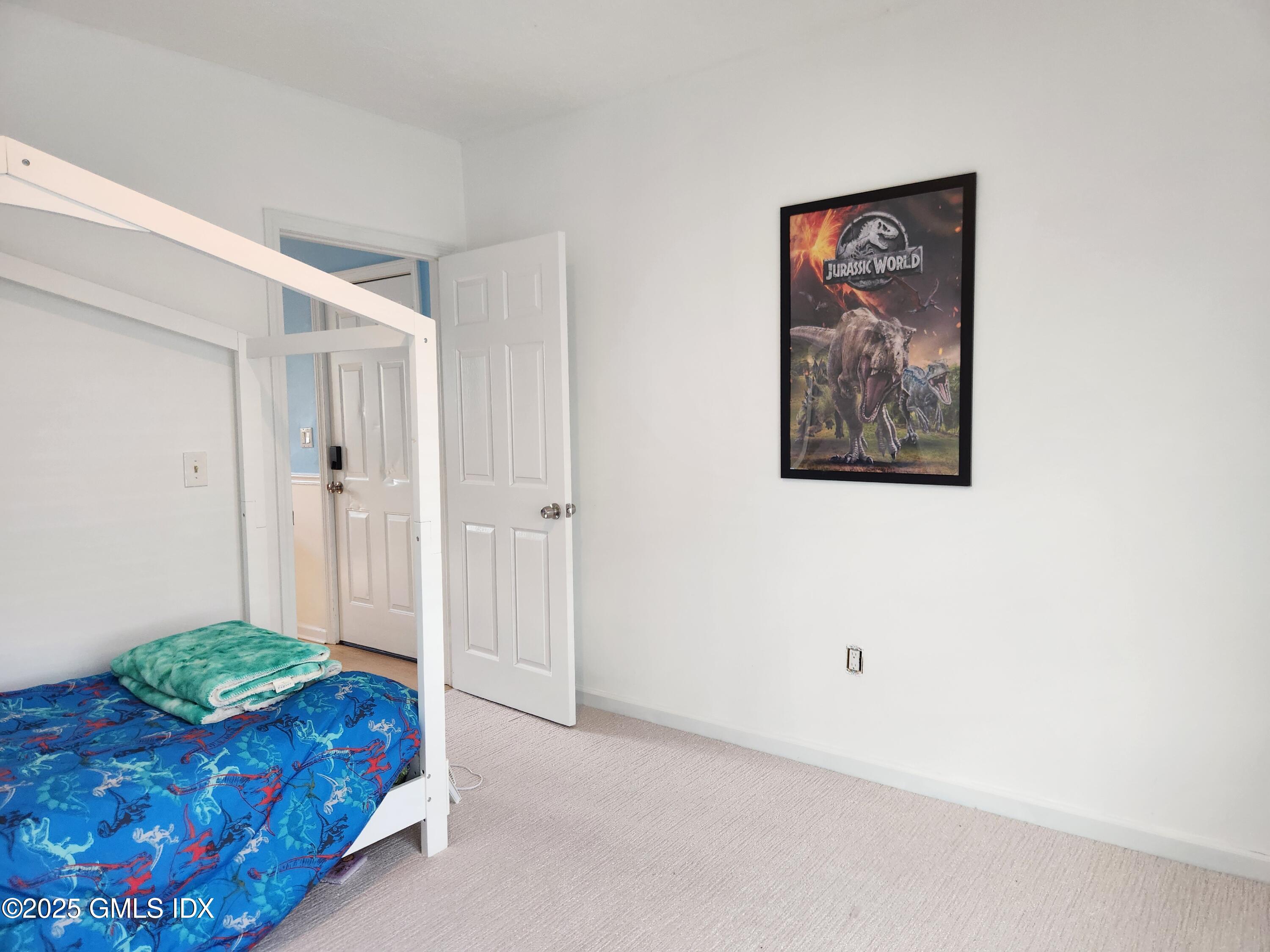 61 Aberdeen Street, Unit 3 Stamford, CT 06902 - Photo 13 of 17 a bedroom with a bed and a painting on the wall