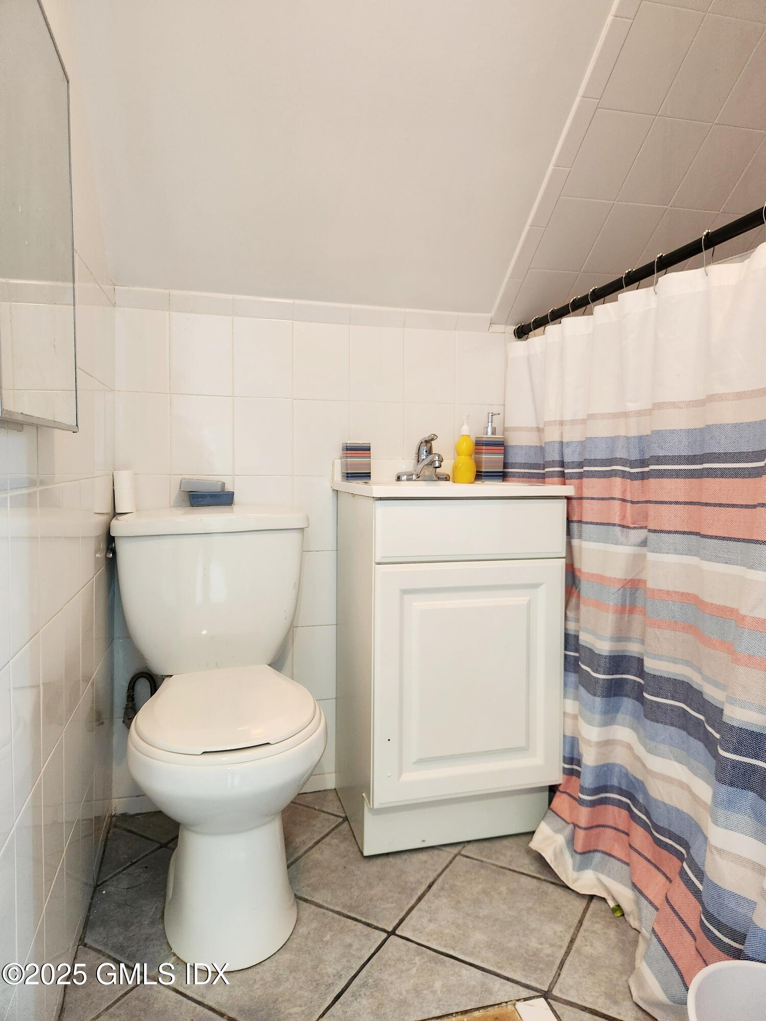 61 Aberdeen Street, Unit 3 Stamford, CT 06902 - Photo 15 of 17 a bathroom with a toilet and a sink