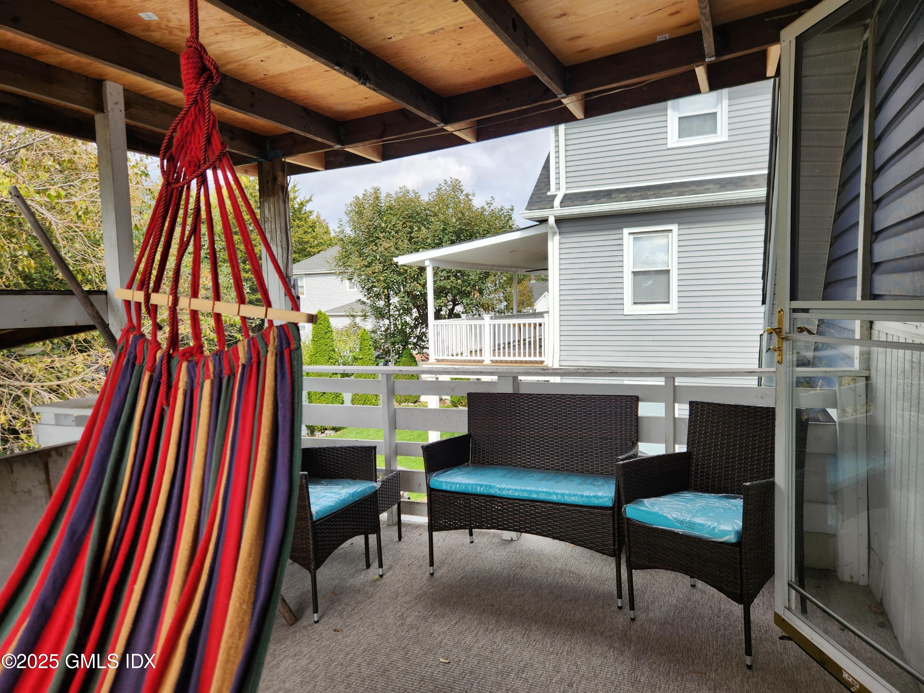 61 Aberdeen Street, Unit 3 Stamford, CT 06902 - Photo 17 of 17 a backyard of a house with outdoor seating