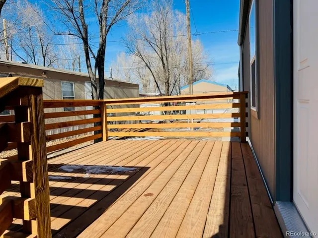 a view of a livingroom with a ceiling fan and window